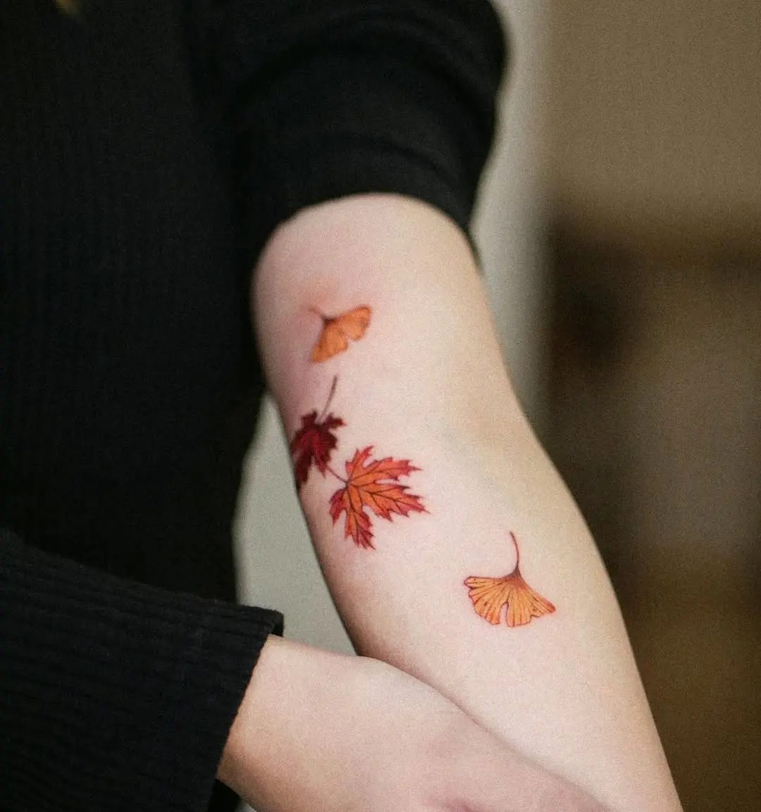 Vibrant maple leaf tattoo showcasing autumn colors