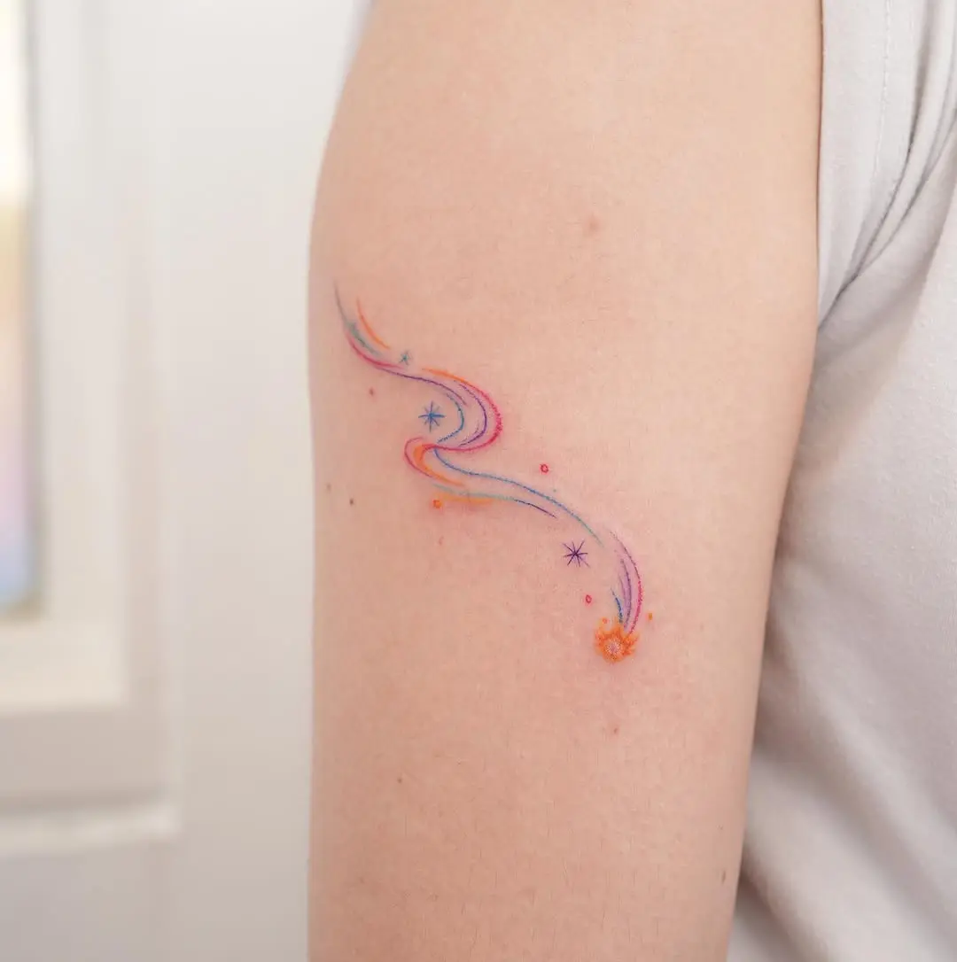 Vibrant meteor tattoo with stellar accents