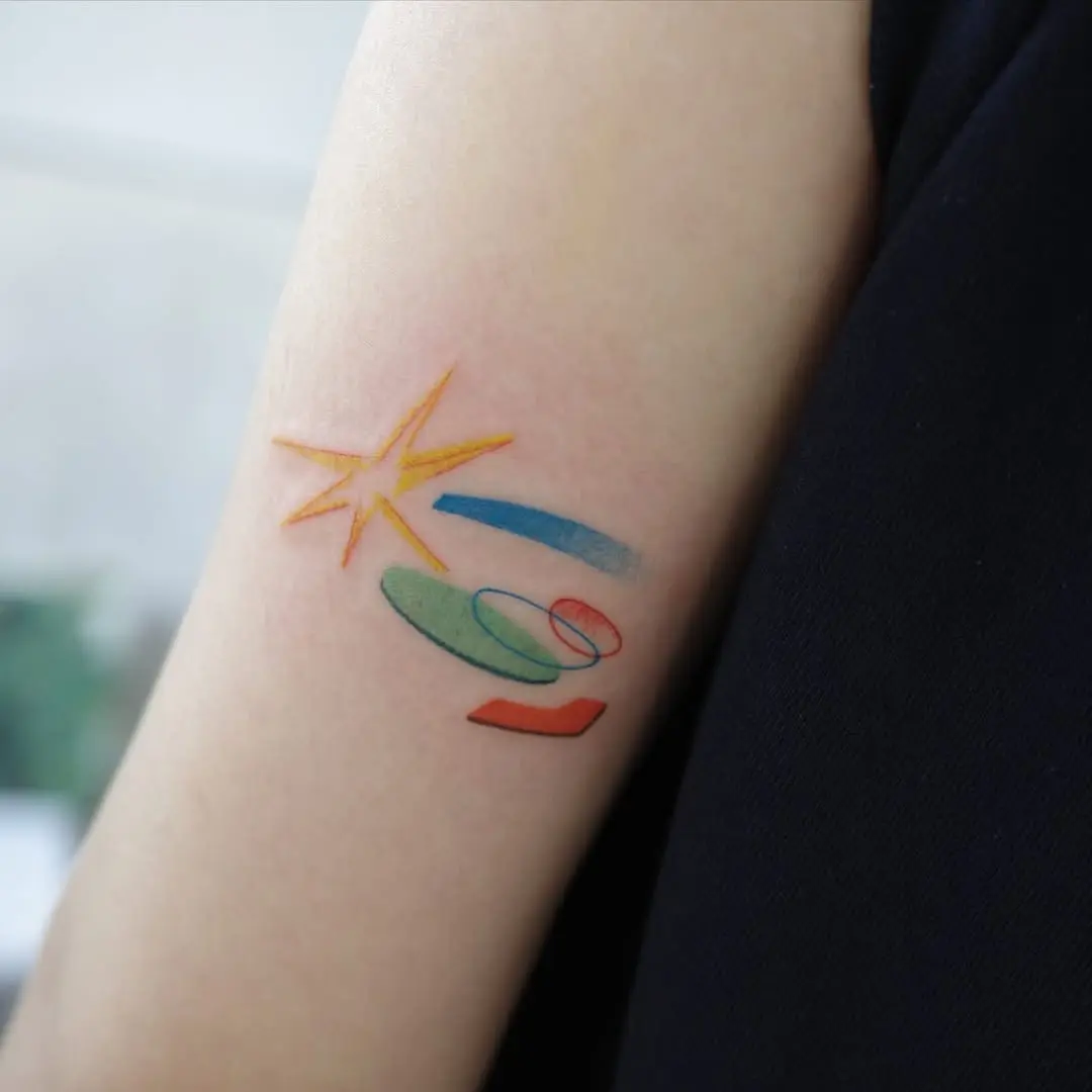 Vibrant meteor-themed tattoo with playful shapes