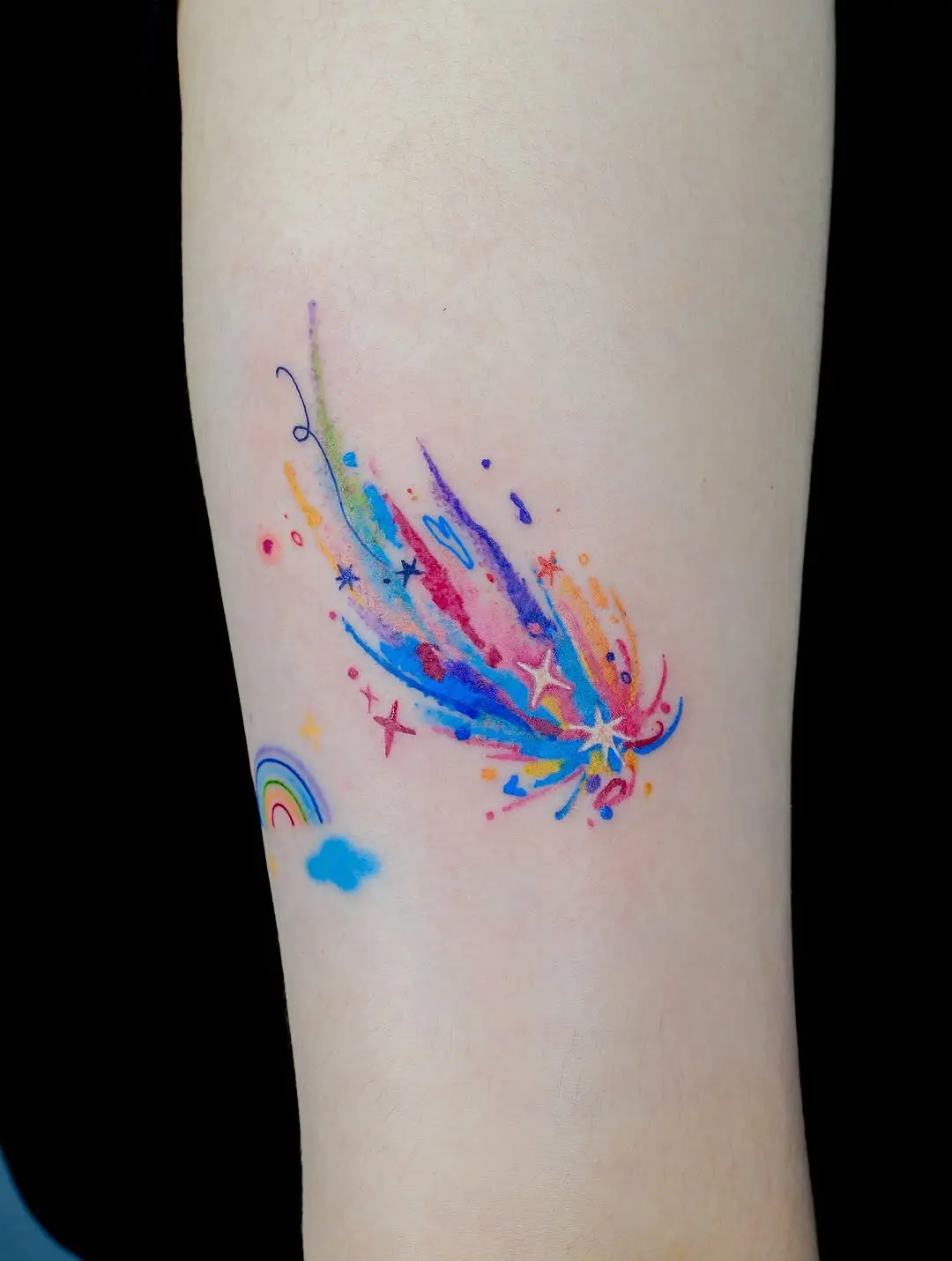 Vibrant Meteor Tattoo with Rainbow Accents