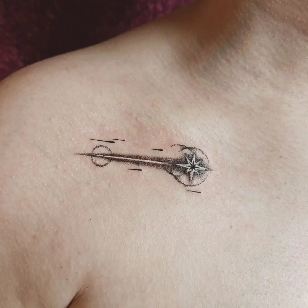 Sleek Meteor Tattoo with Compass Elements