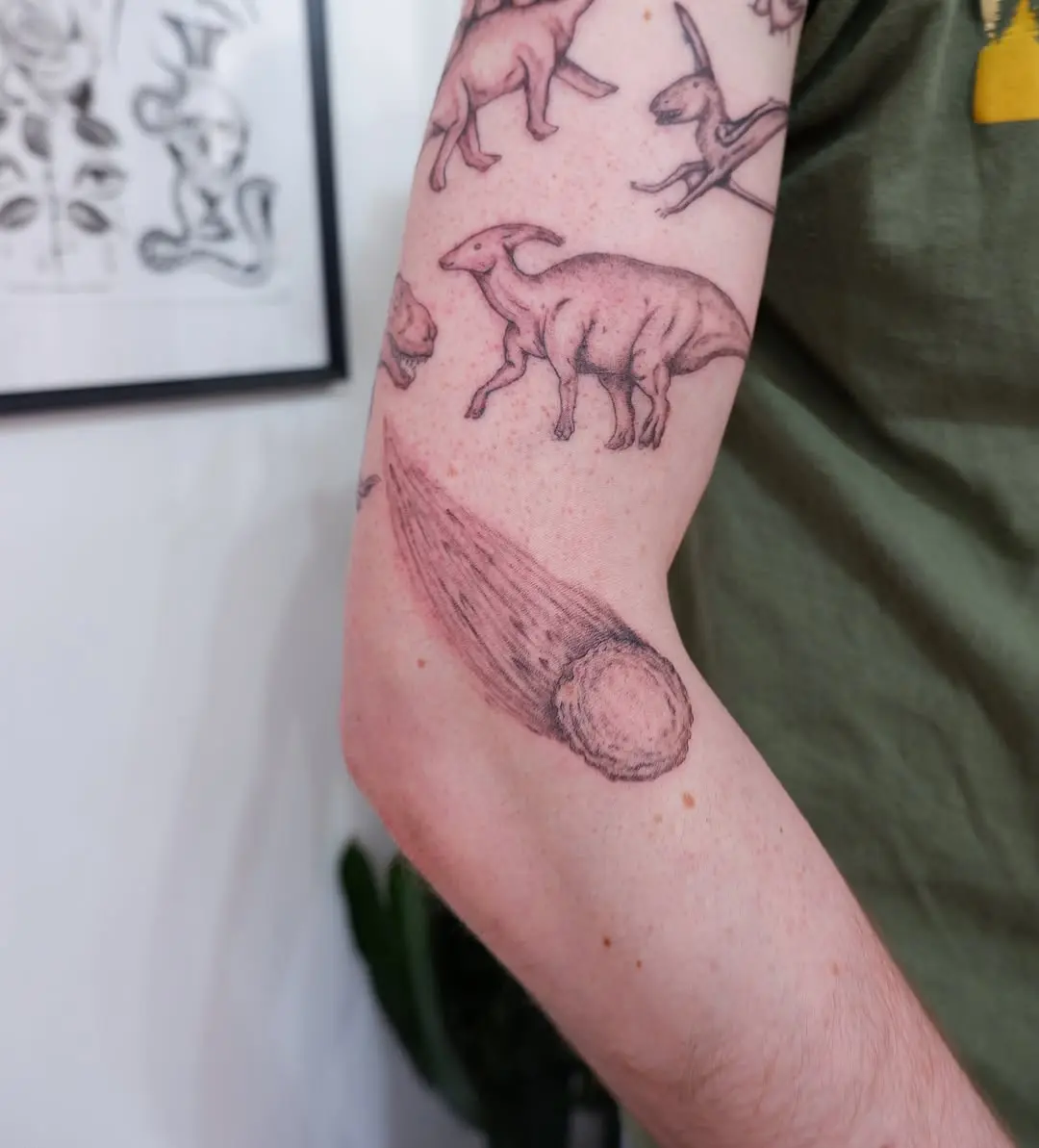 Unique Meteor Tattoo with Vintage Dinosaur Design