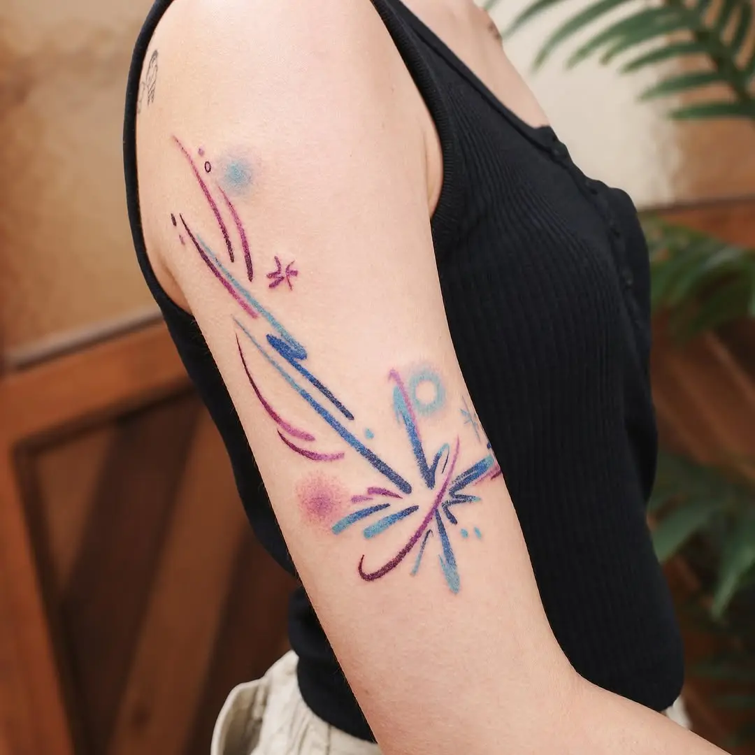 Dynamic meteor tattoo with colorful flair