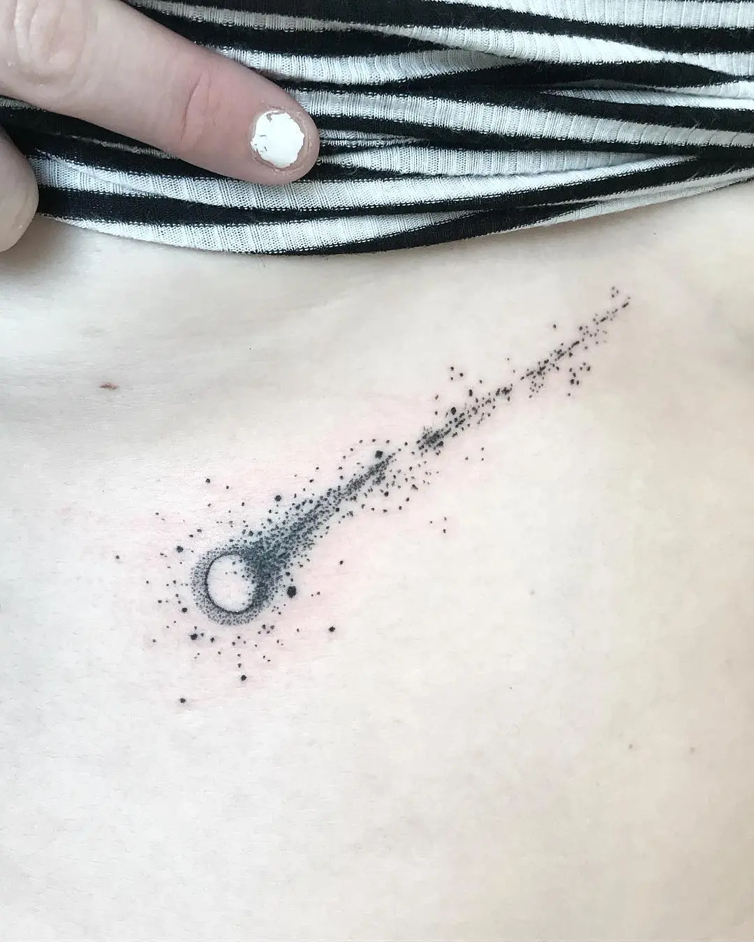 Stunning meteor tattoo with cosmic details