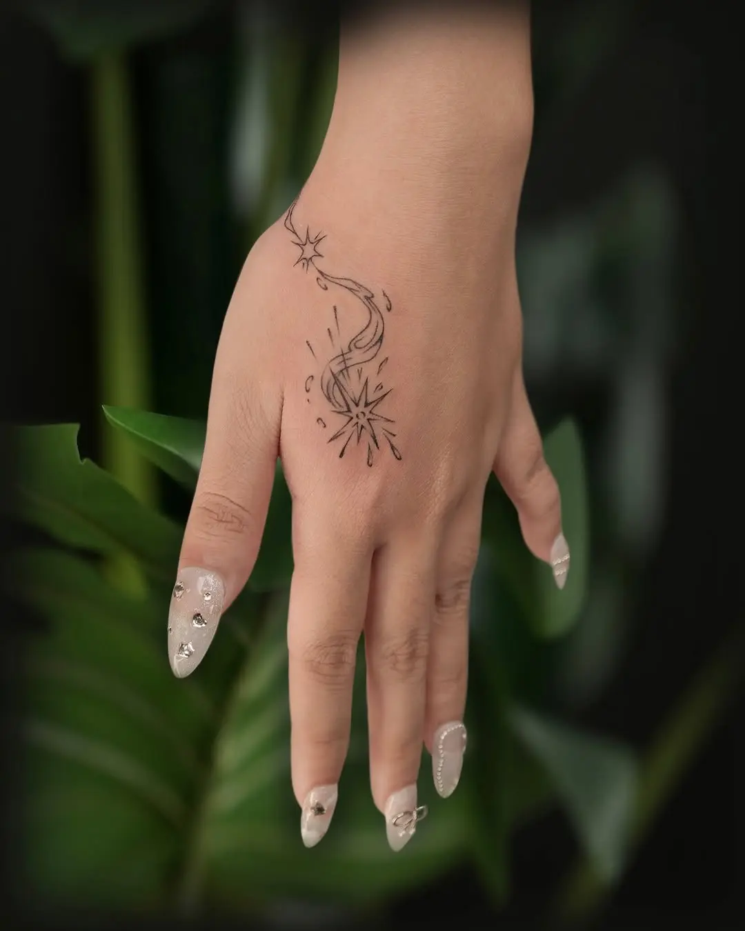 Stunning meteor tattoo on a graceful hand
