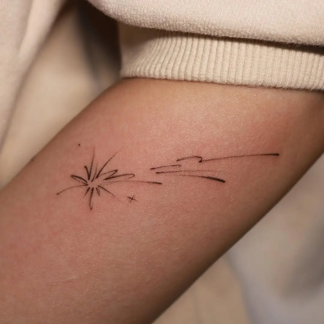 Minimalist meteor tattoo for cosmic vibes