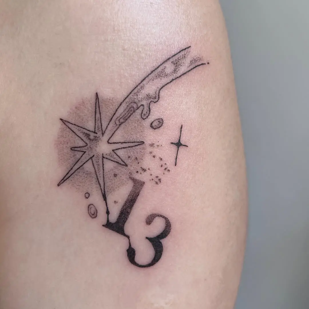 Stylish meteor tattoo with number thirteen design