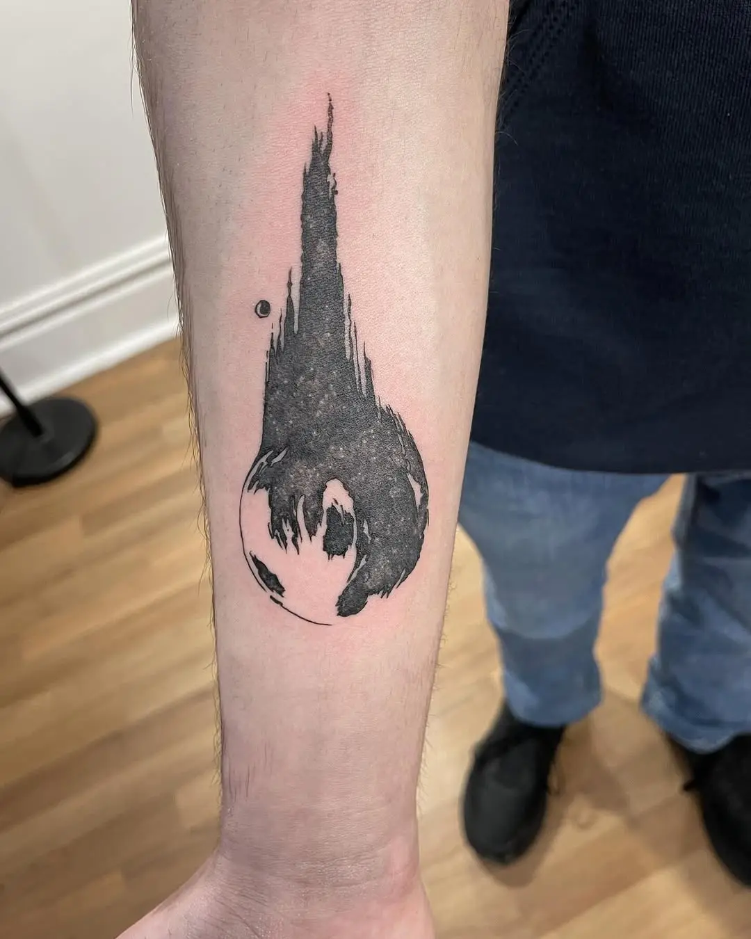 Stylized Meteor Tattoo on Forearm