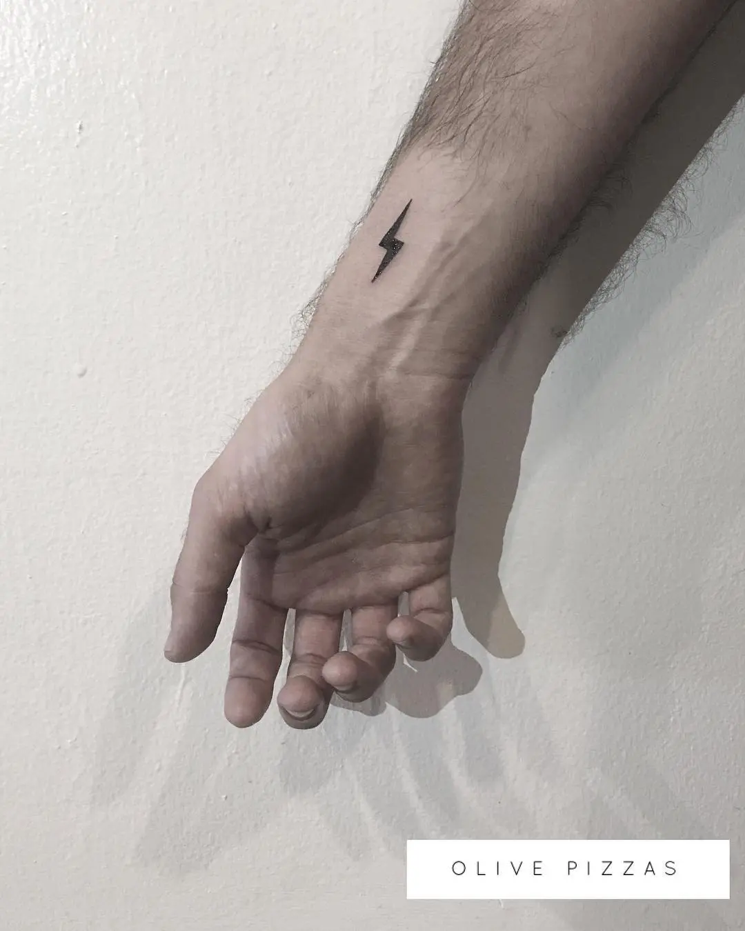 Stylish and minimalistic lightning bolt tattoo