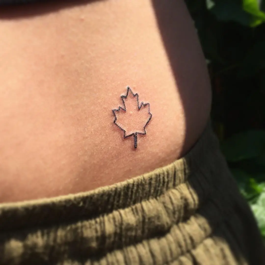 Elegant minimalist maple leaf tattoo design