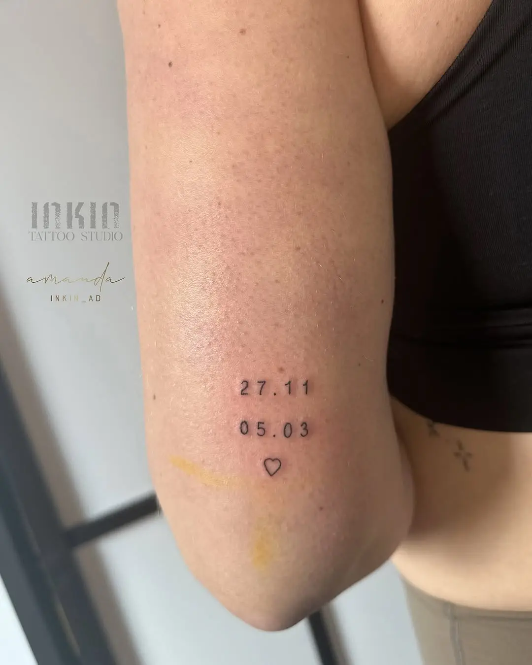 Charming minimalist date tattoo with heart