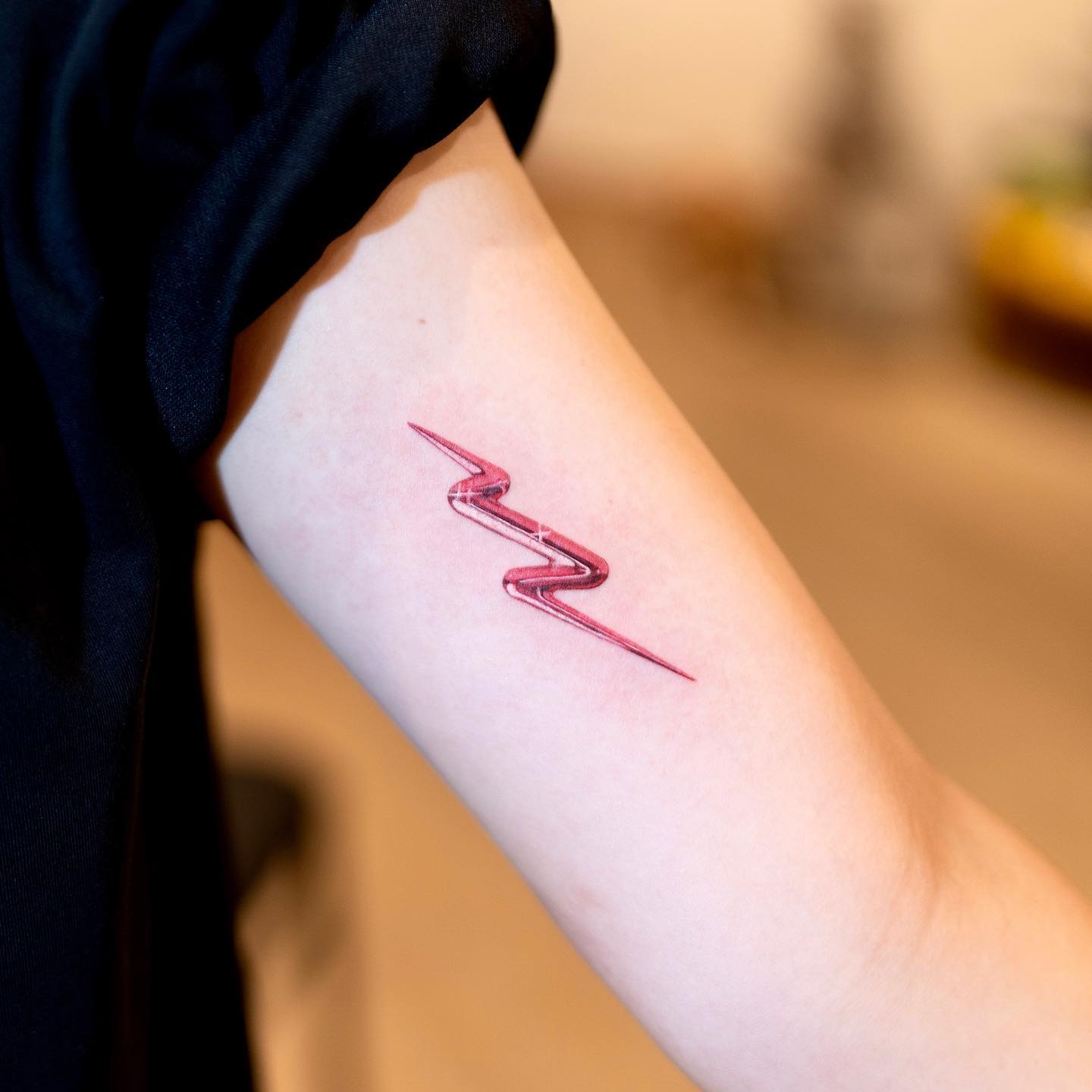 Stylish Lightning Bolt Tattoo on Forearm