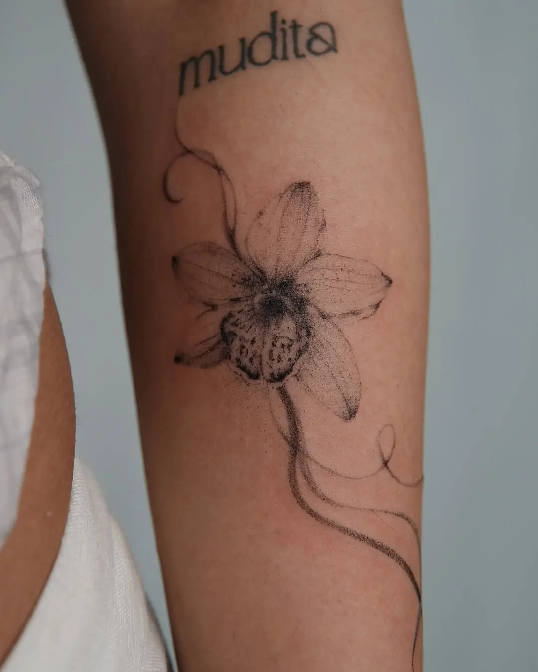 Elegant orchid tattoo with intricate details