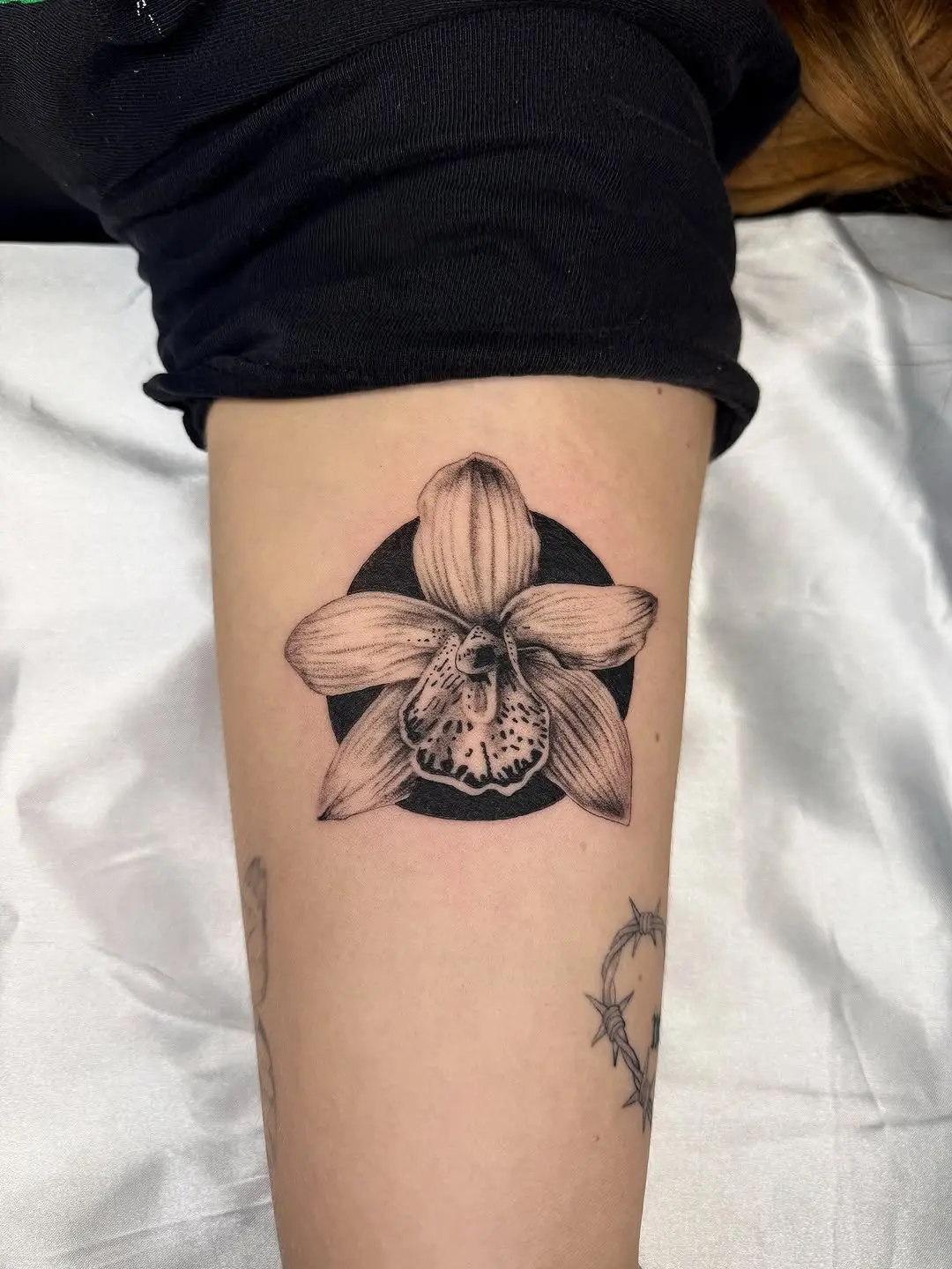 Elegant black and gray orchid tattoo design