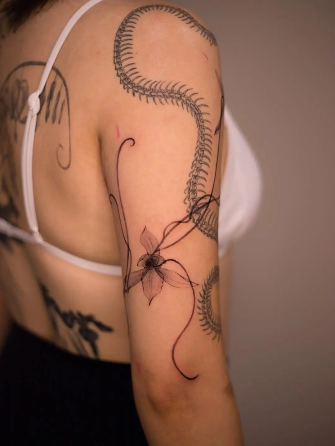 Elegant orchid tattoo with intricate designs
