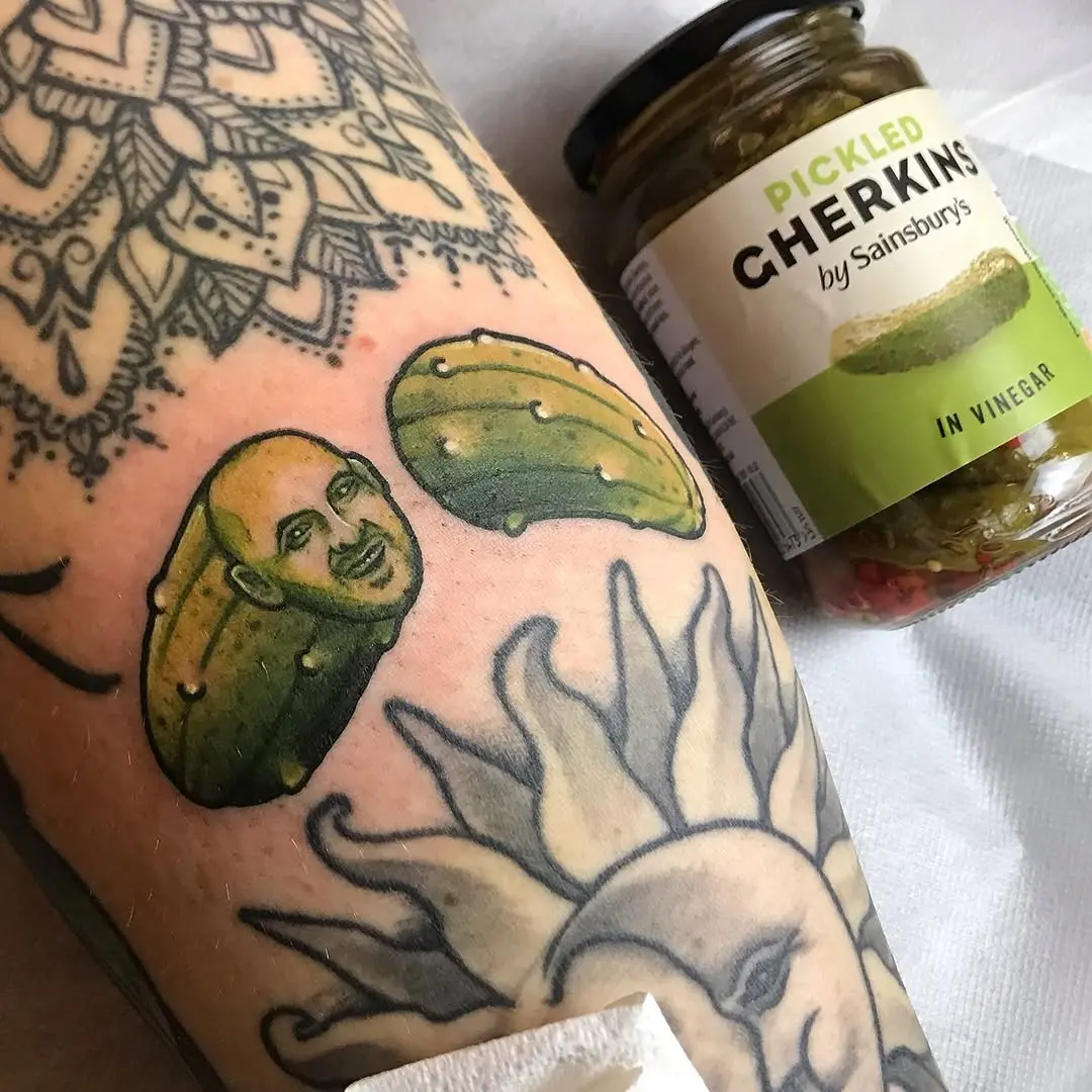 Fun and quirky pickle tattoo with a face