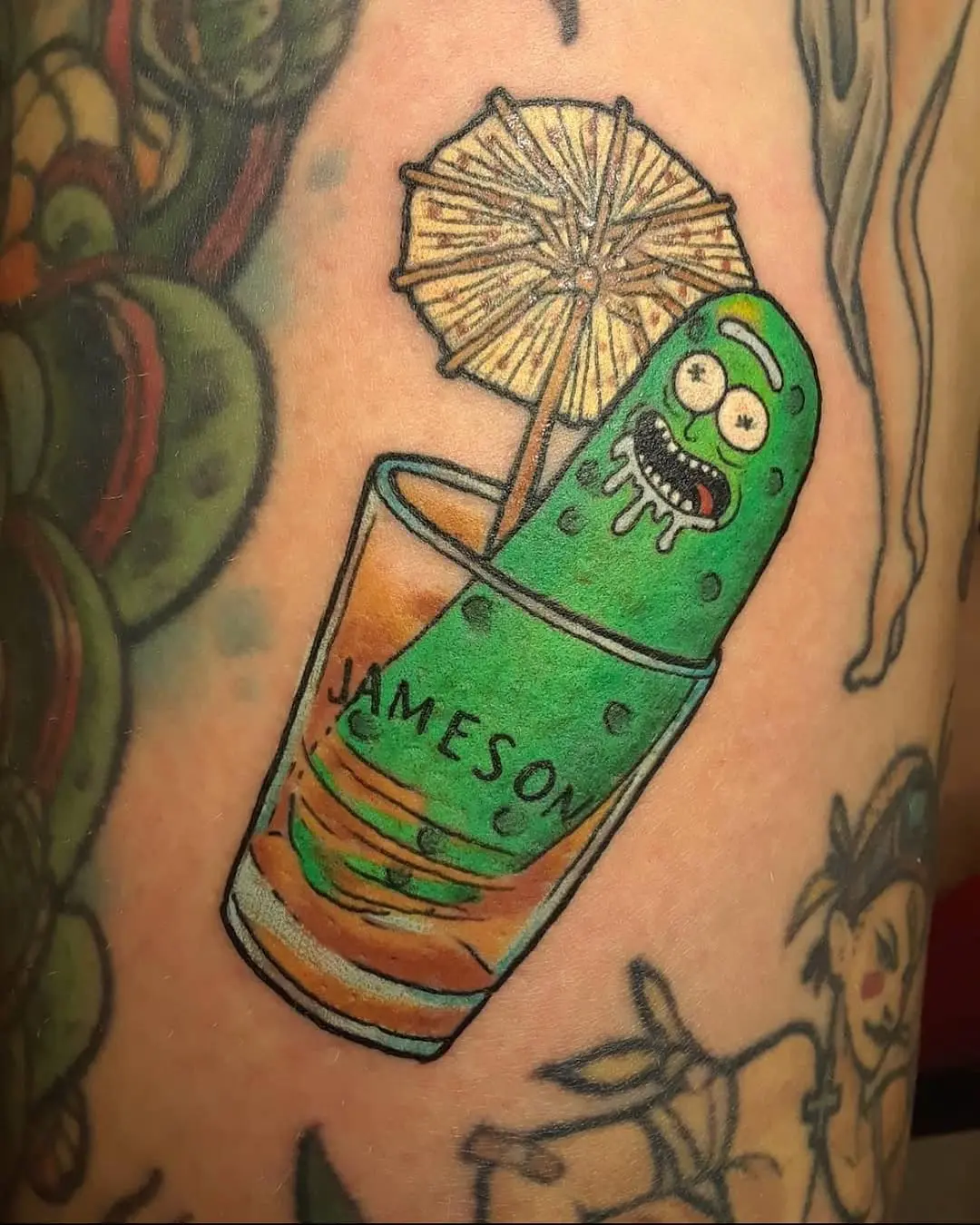 Humorous pickle tattoo with Jameson vibes