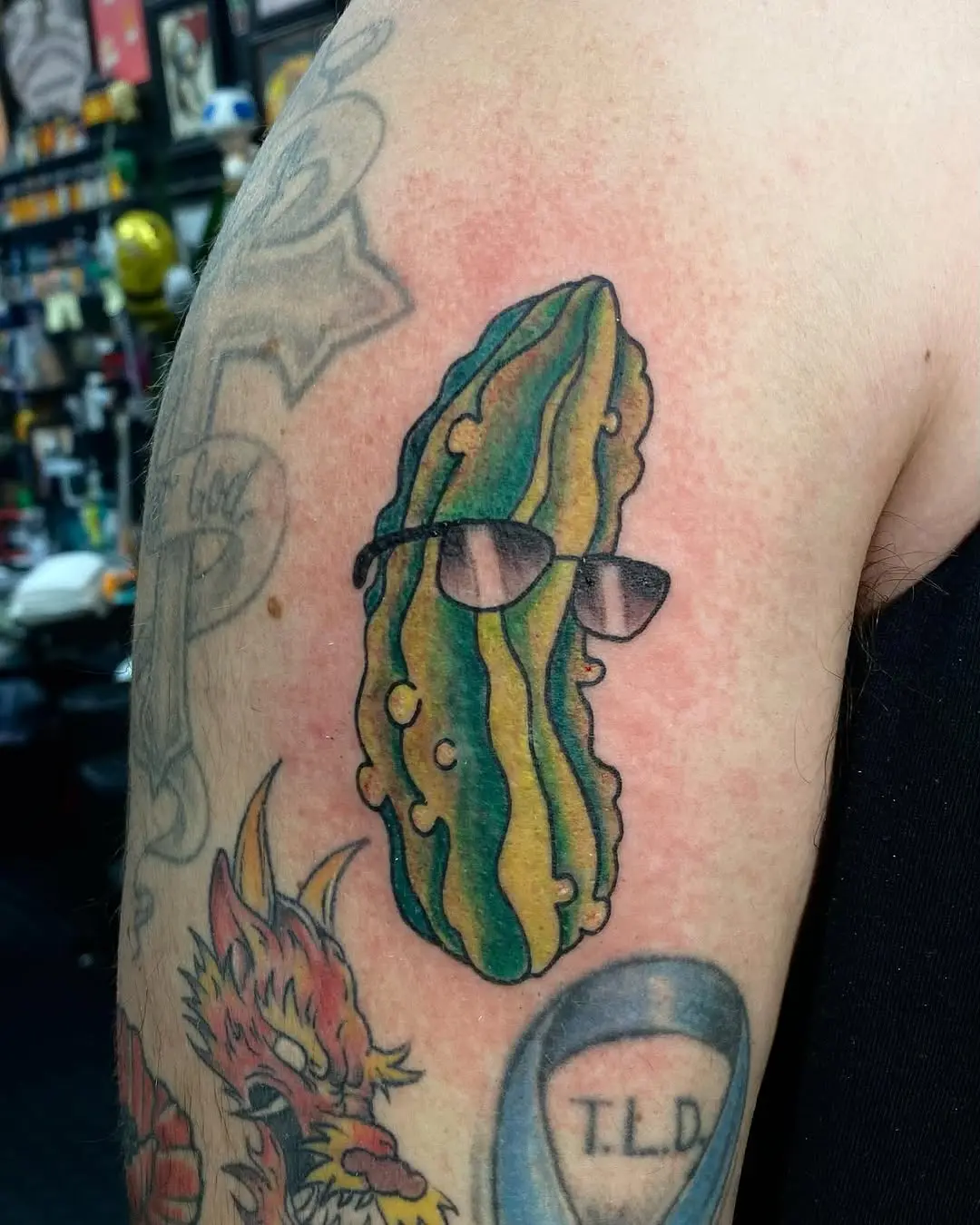 Cool pickle tattoo rocking stylish sunglasses