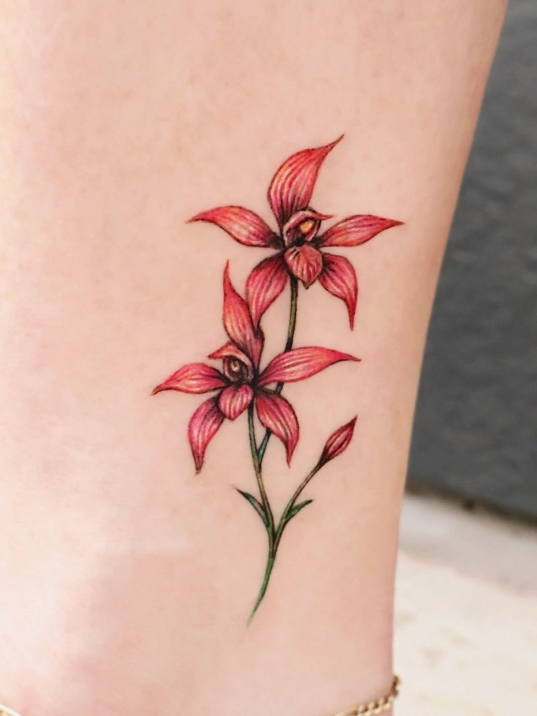 Elegant pink and red orchid tattoo design