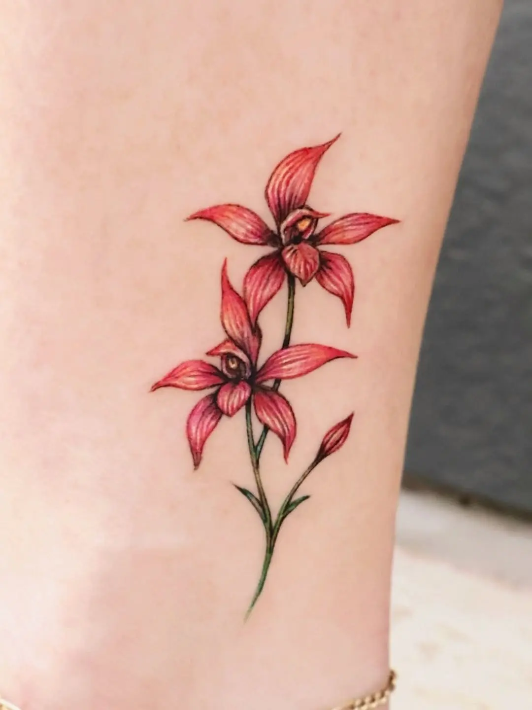 Elegant pink and red orchid tattoo design