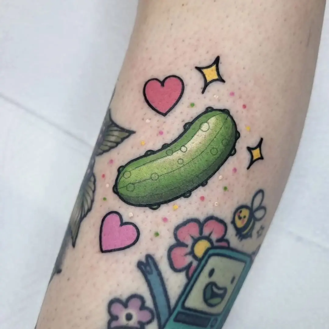 Fun and vibrant pickle tattoo with cute elements
