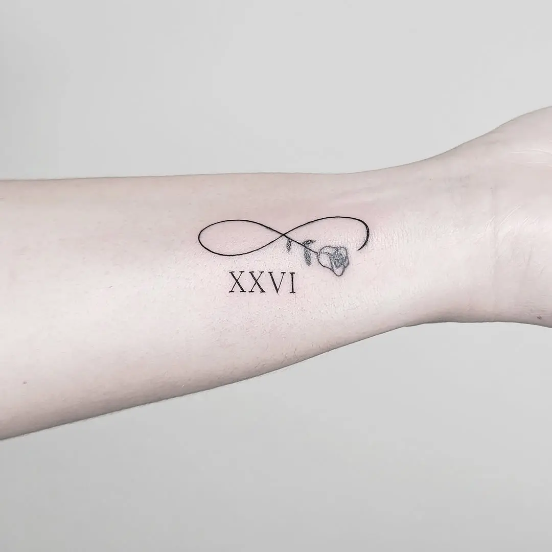 Elegant infinity with Roman numeral XXVI tattoo