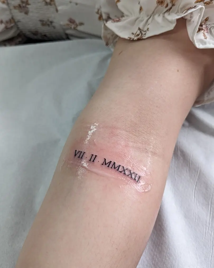 Stylish Roman Numeral Date Tattoo Concept