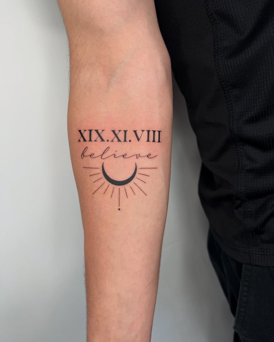 Roman numeral tattoo with celestial elements