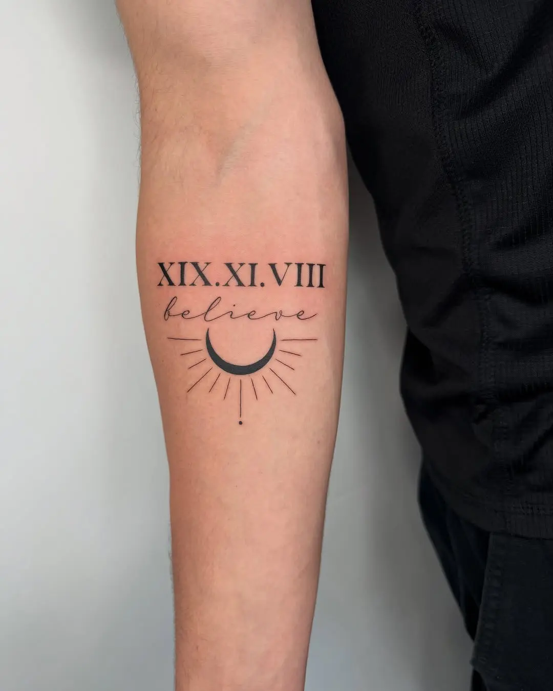 Roman numeral tattoo with celestial elements