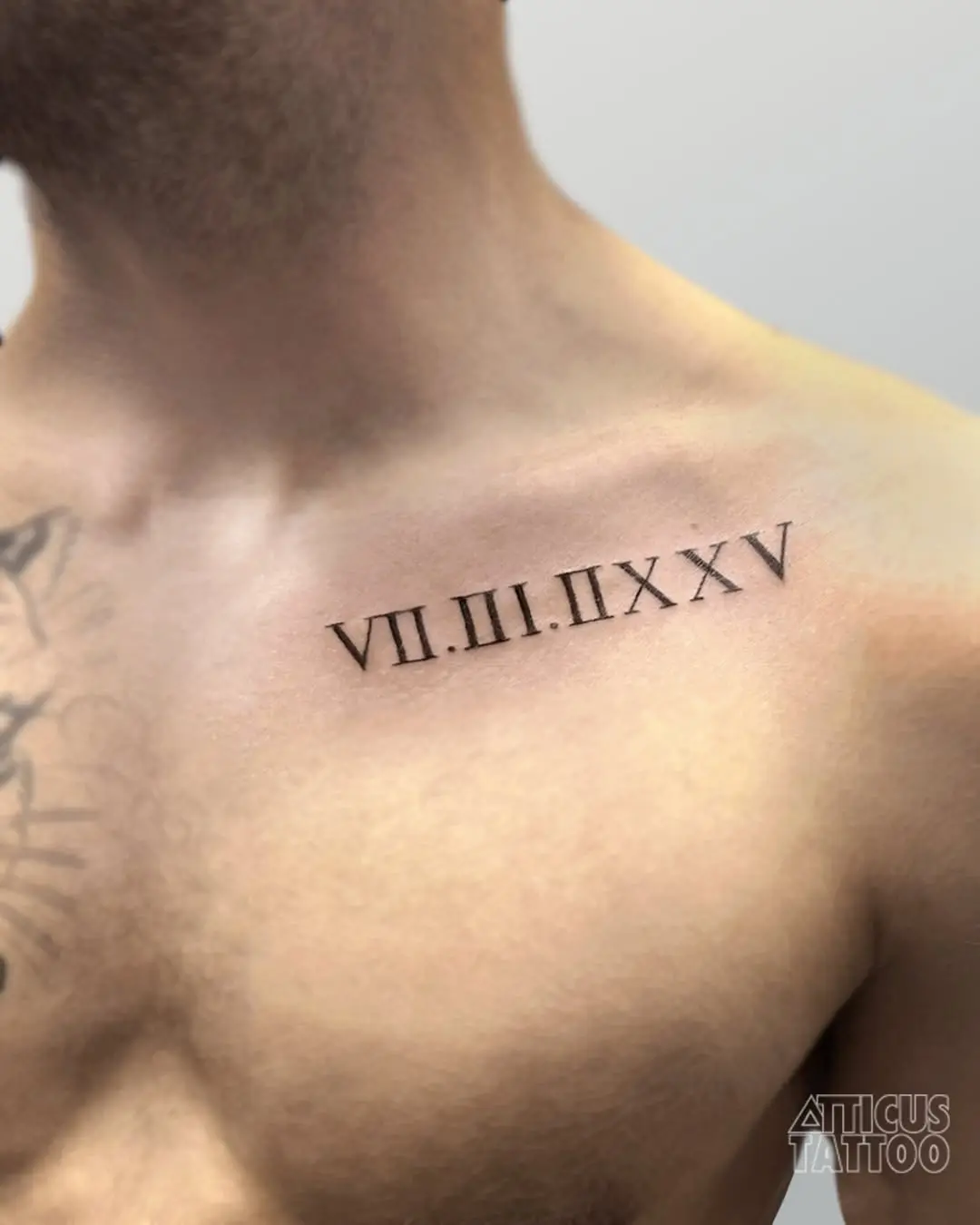 Stylish roman numeral tattoo for men on chest