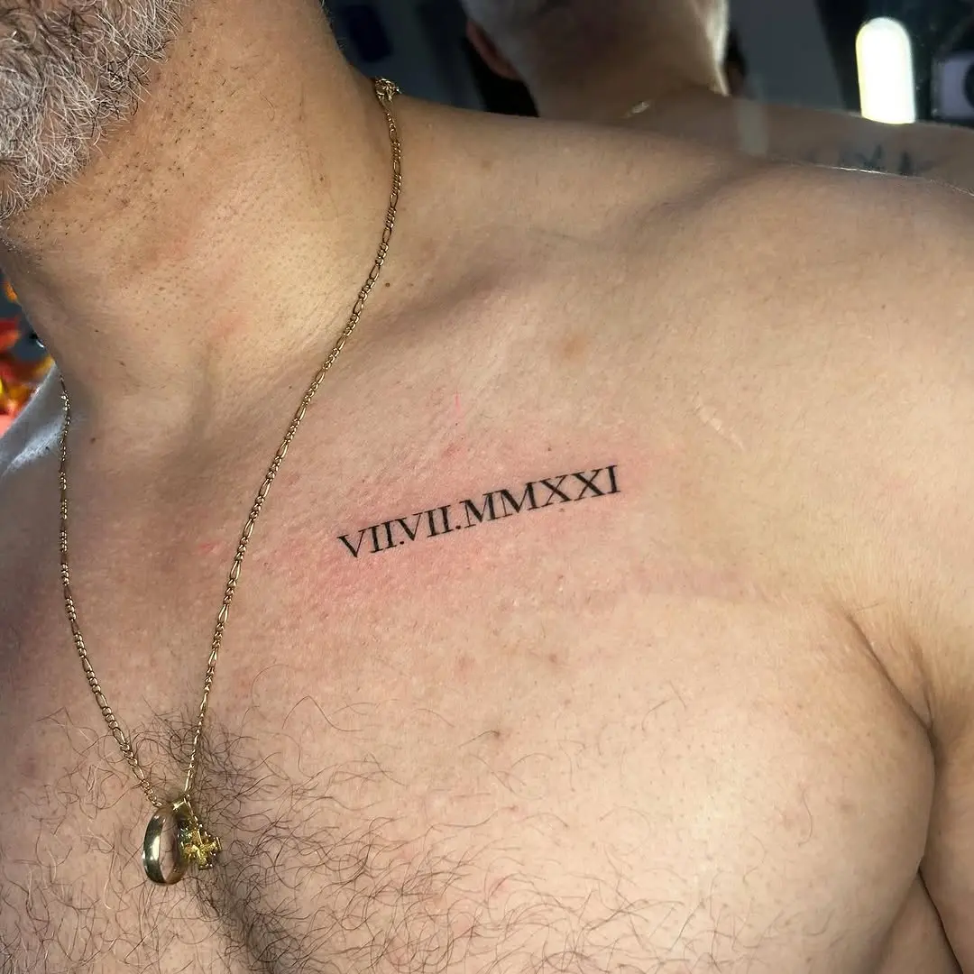 Symbolic chest tattoo with roman numerals