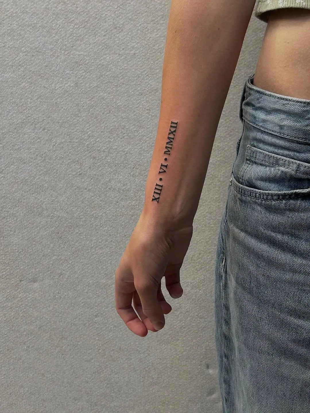 Elegant Roman Numerals on Forearm