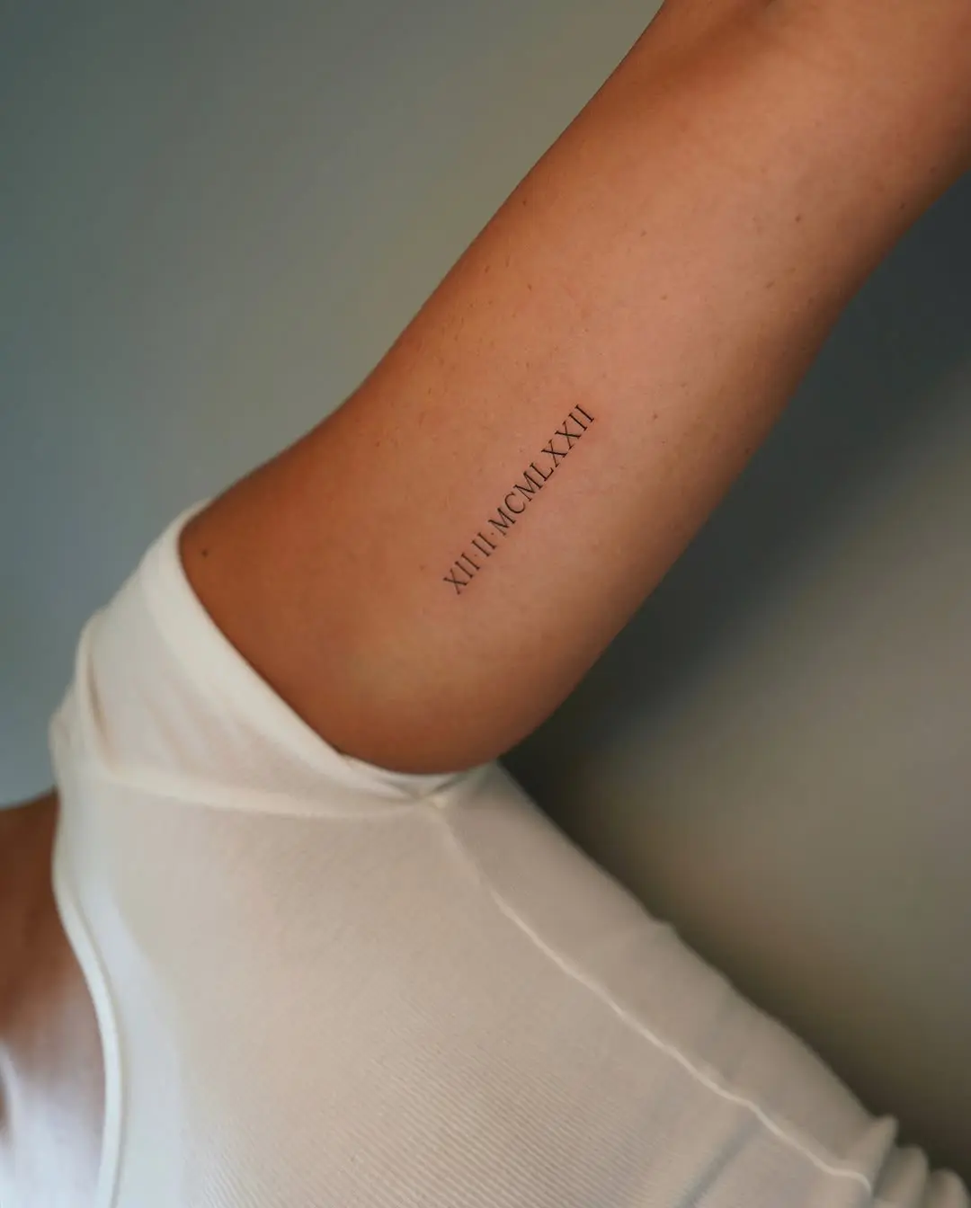 Stylish Roman Numeral Tattoo on Forearm