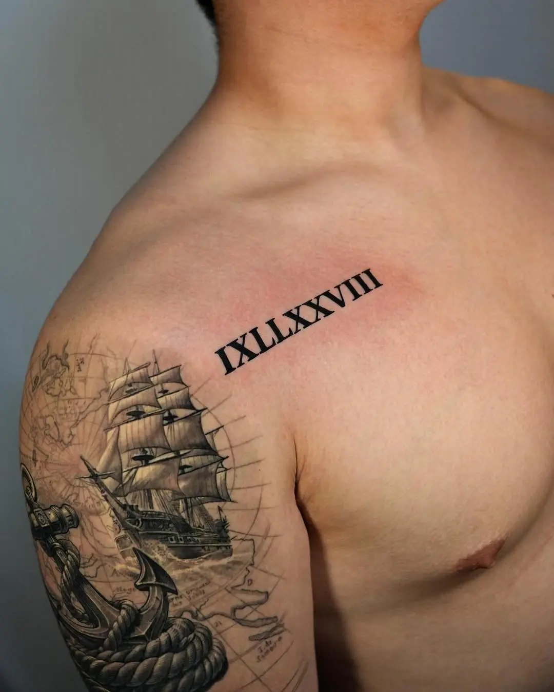 Bold Roman Numeral Tattoo with Nautical Theme