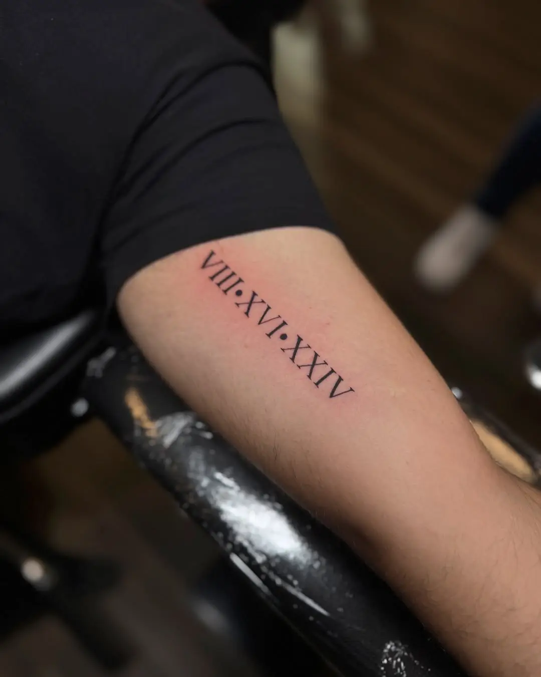 Elegant Roman Numerals Inked on the Arm