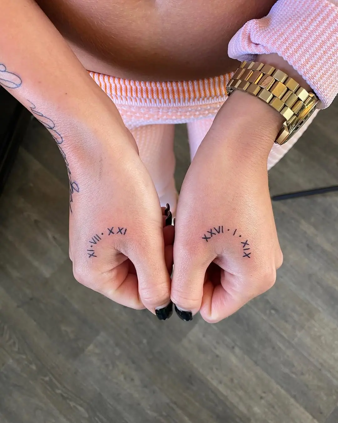 Stylish Roman Numeral Hand Tattoos for Meaningful Moments