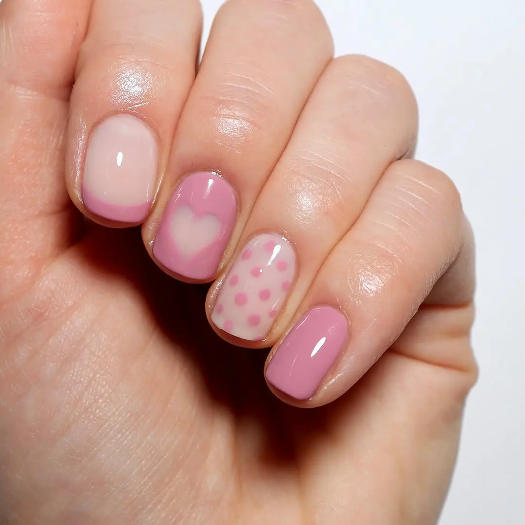 Charming pink nails with playful heart design