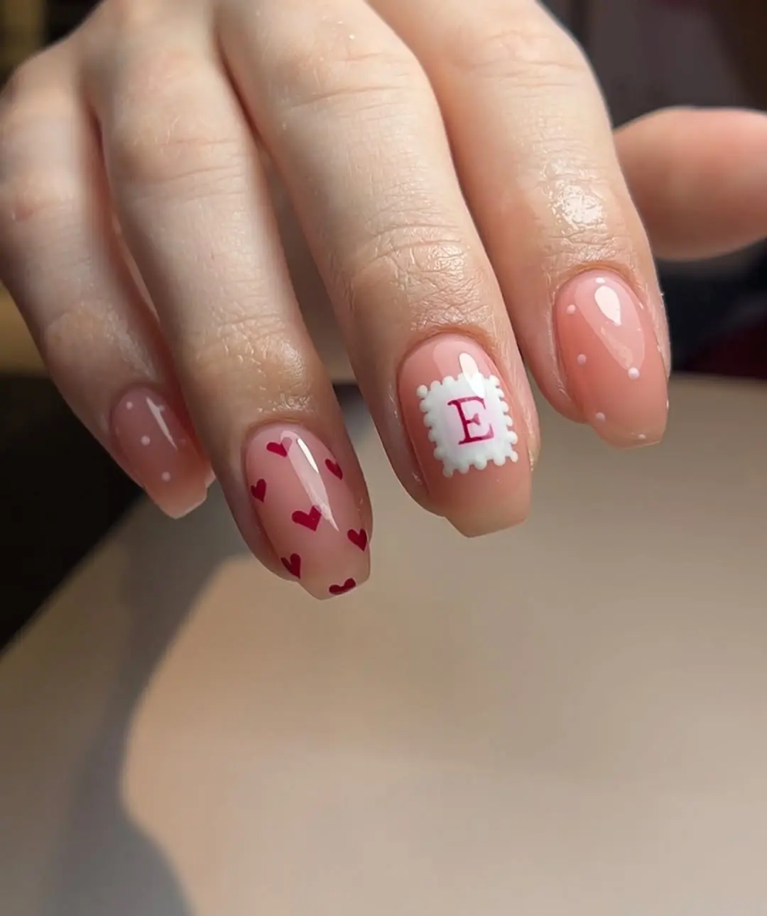 Playful nails with hearts and a stamp illustration