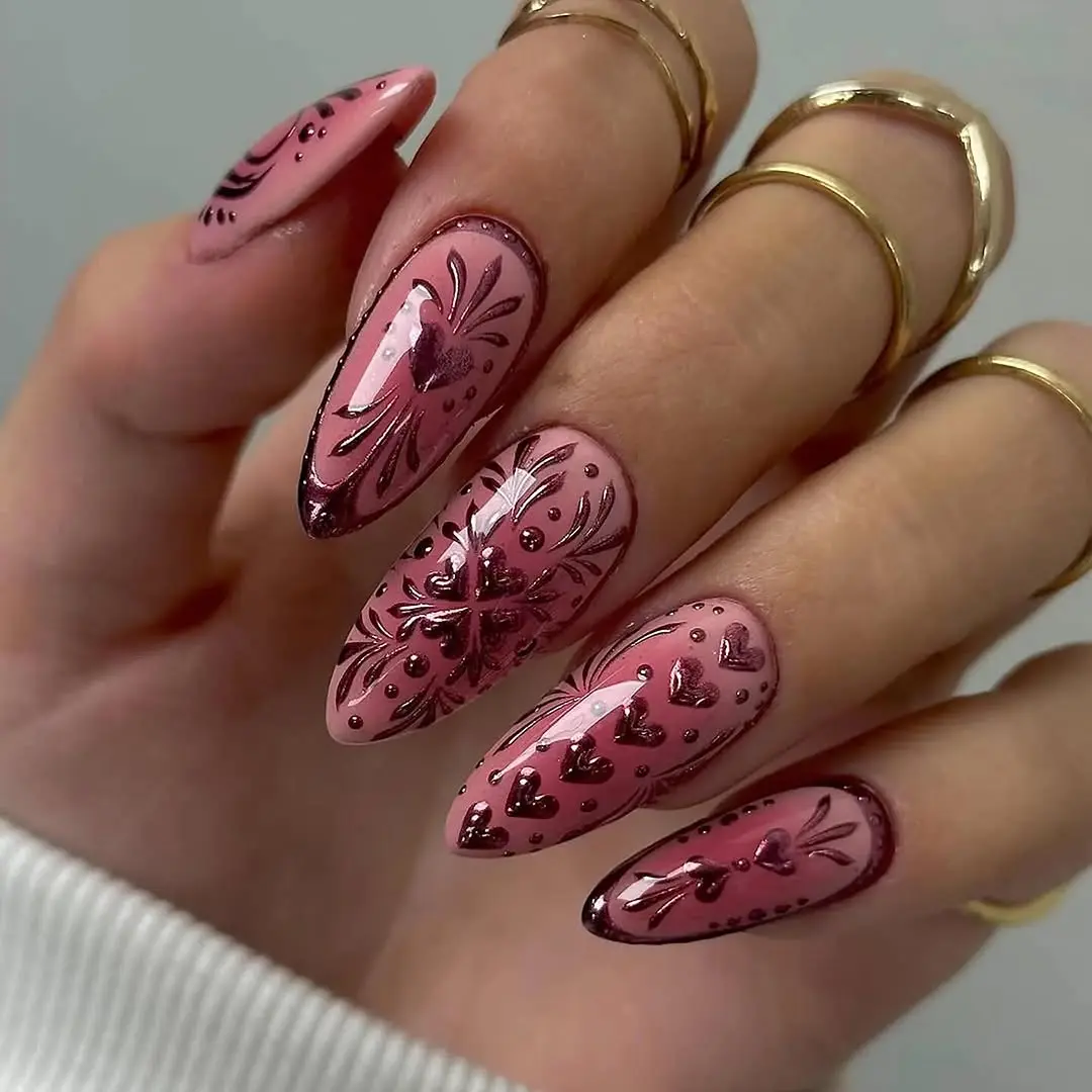 Stylish pink nails adorned with hearts
