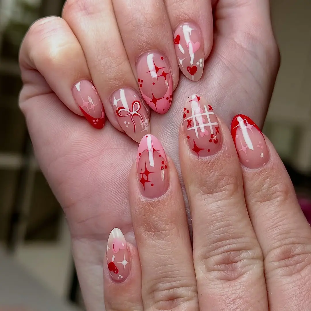 Charming red hearts and sparkles nail art