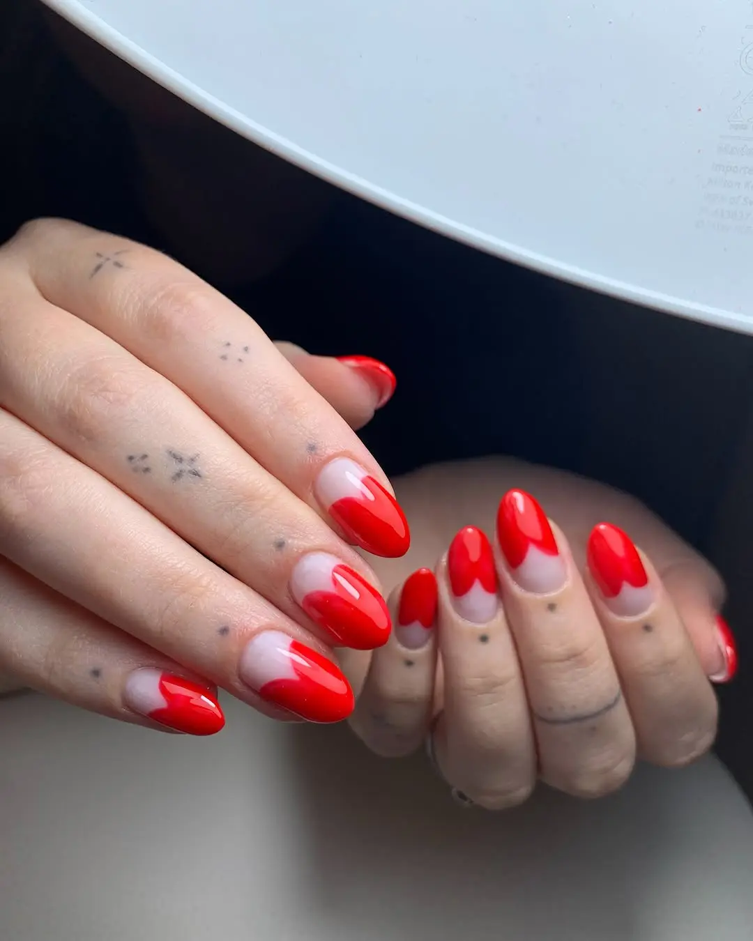 Glossy red romantic nails with elegant design