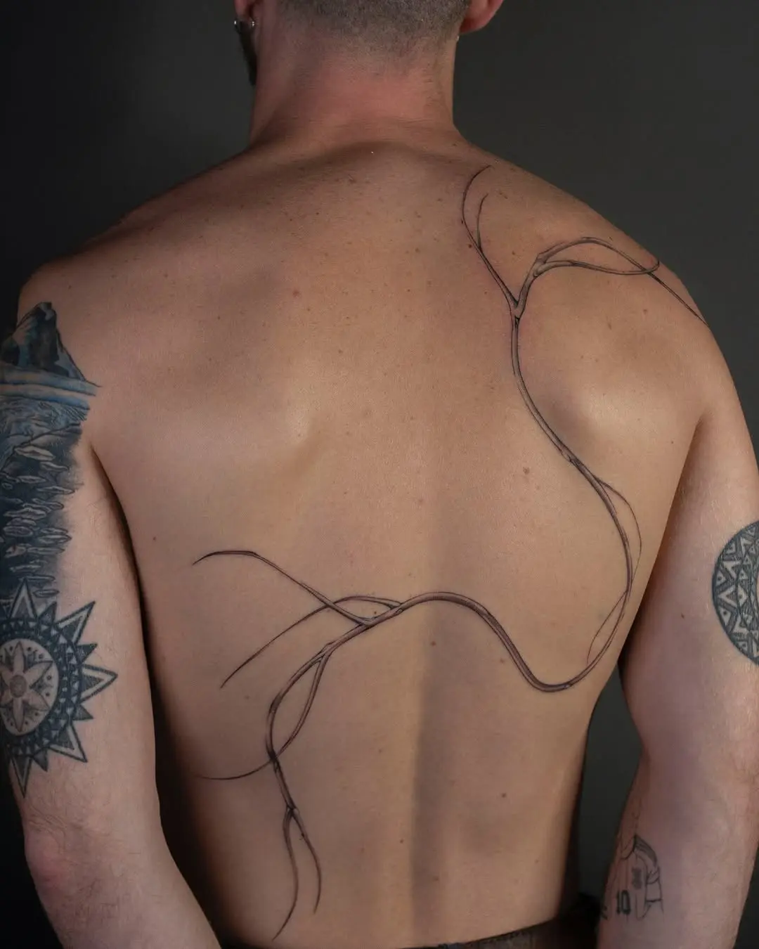 Elegant roots tattoo embodying nature's connection