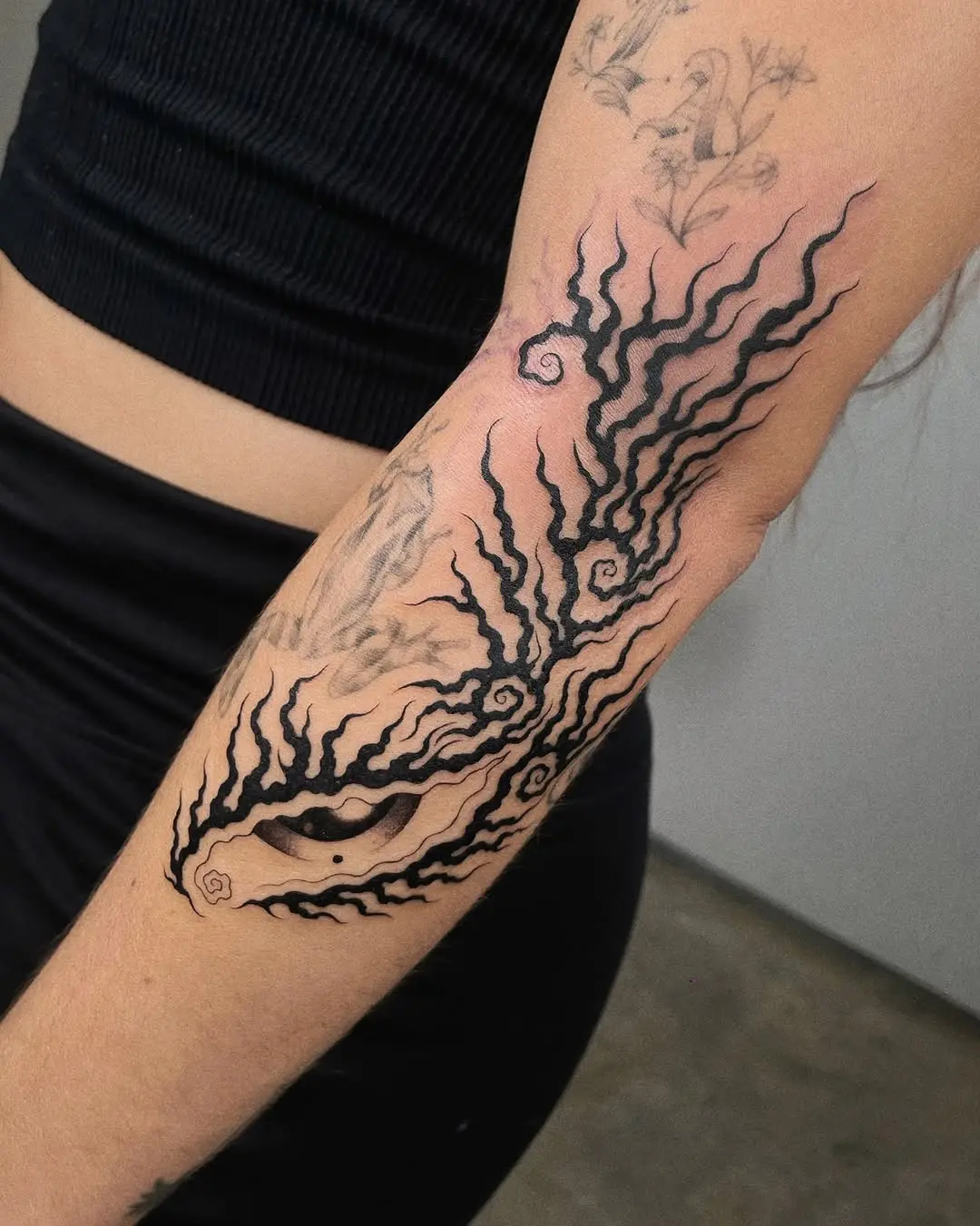 Intricate roots tattoo design with swirling patterns