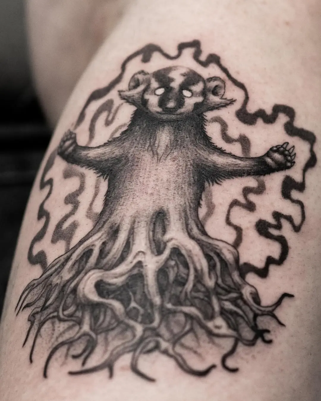 Unique roots tattoo blending animal and nature