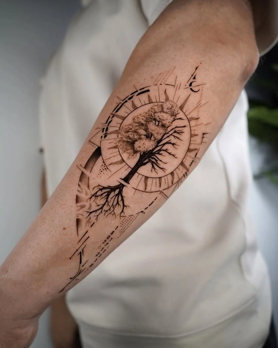 Elegant geometric roots tattoo design