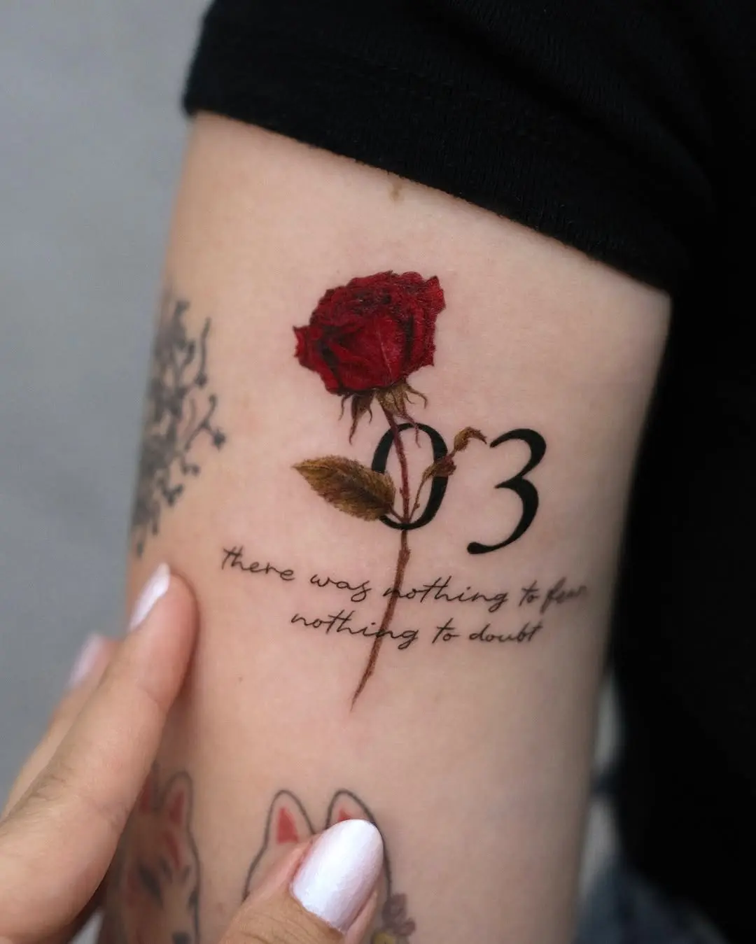 Elegant rose tattoo with a meaningful date