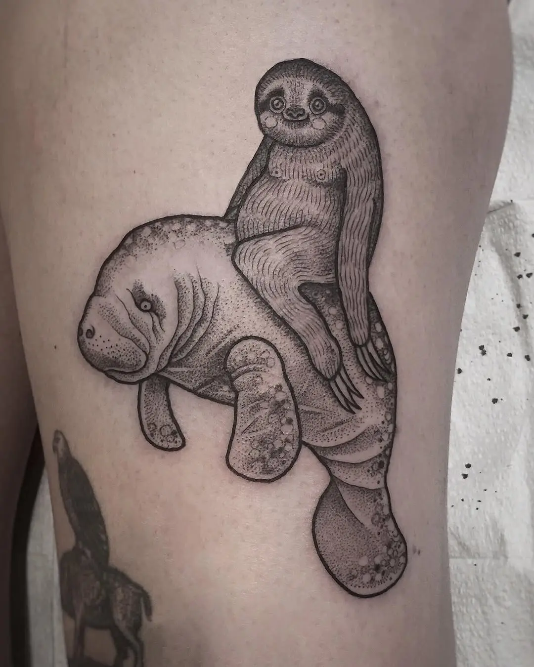 Adorable sloth tattoo riding a manatee