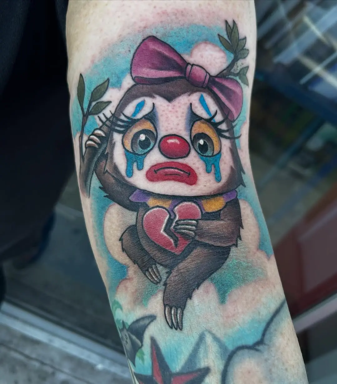 Whimsical sloth clown tattoo with emotional flair