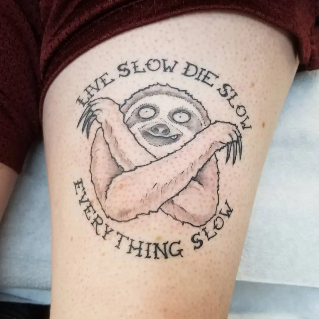 Whimsical sloth tattoo with a life mantra