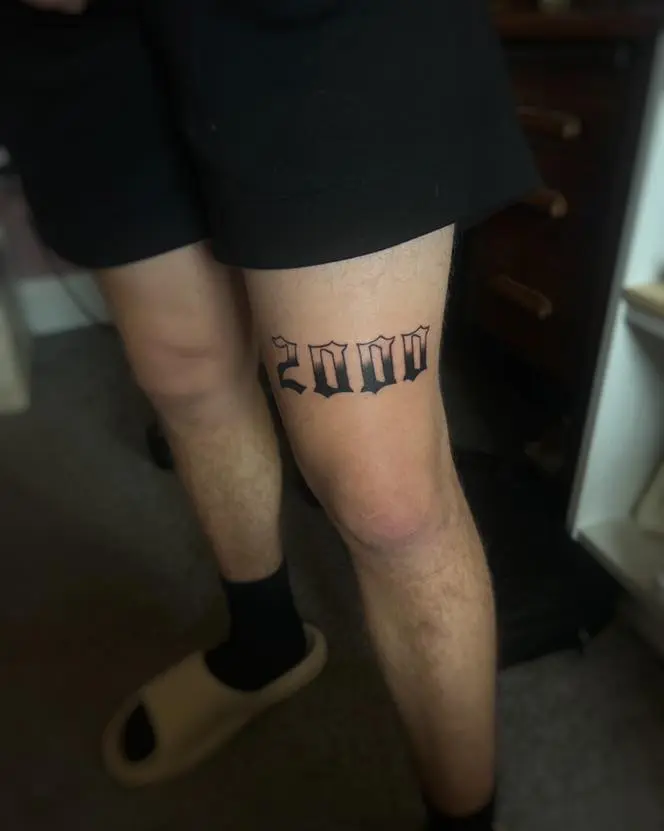 Bold Date Tattoo Representing a Significant Year